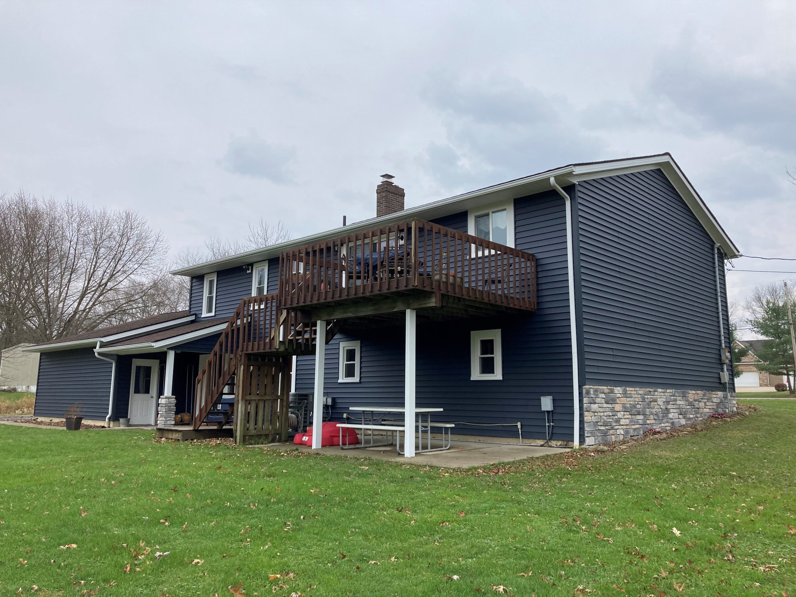 Custom shutters & accents installed on an Akron home, featuring louvered shutters, gable vents, and decorative pilasters for a standout exterior look.